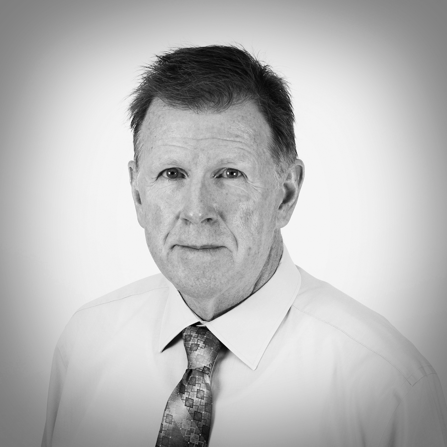 Black and white portrait of Dennis Daily